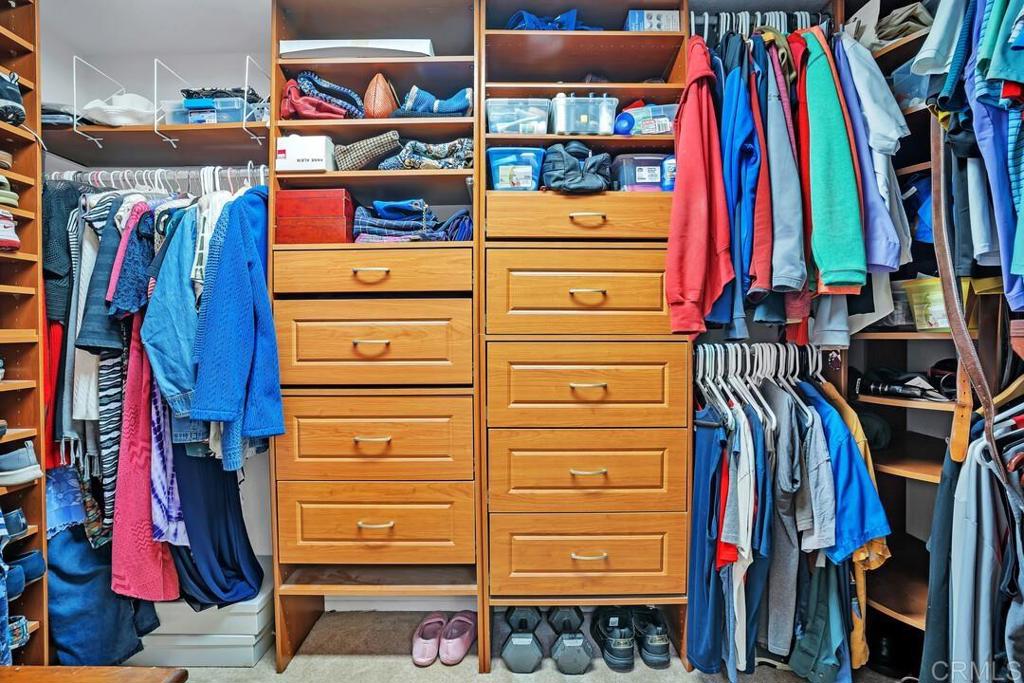 4617 Cyrus Way Oceanside, CA 92056 - Photo 35 of 63 a view of walk in closet with clothes and shoes