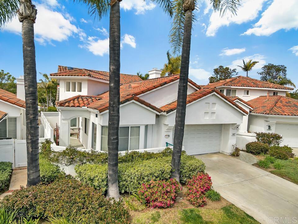 4617 Cyrus Way Oceanside, CA 92056 - Photo 36 of 63 front view of a house with a yard and an trees