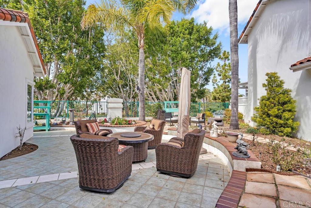 4617 Cyrus Way Oceanside, CA 92056 - Photo 37 of 63 an outdoor sitting area with couch and trees
