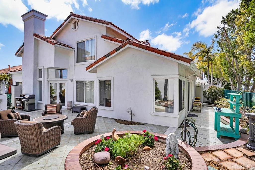 4617 Cyrus Way Oceanside, CA 92056 - Photo 40 of 63 a view of a patio with couches table and chairs and potted plants