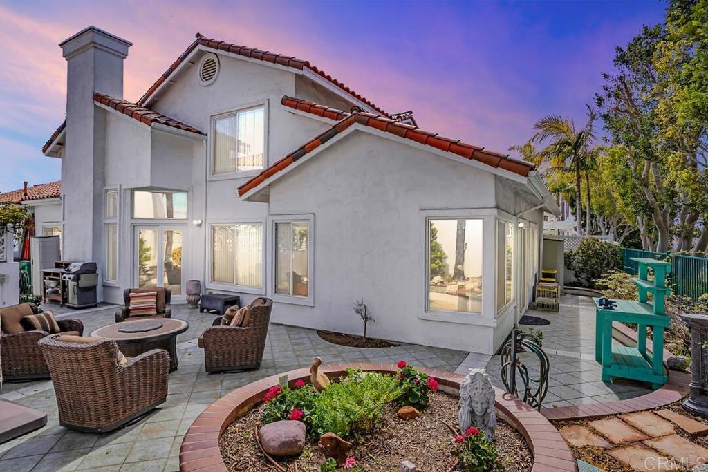 4617 Cyrus Way Oceanside, CA 92056 - Photo 63 of 63 a view of a patio with couches table and chairs and potted plants