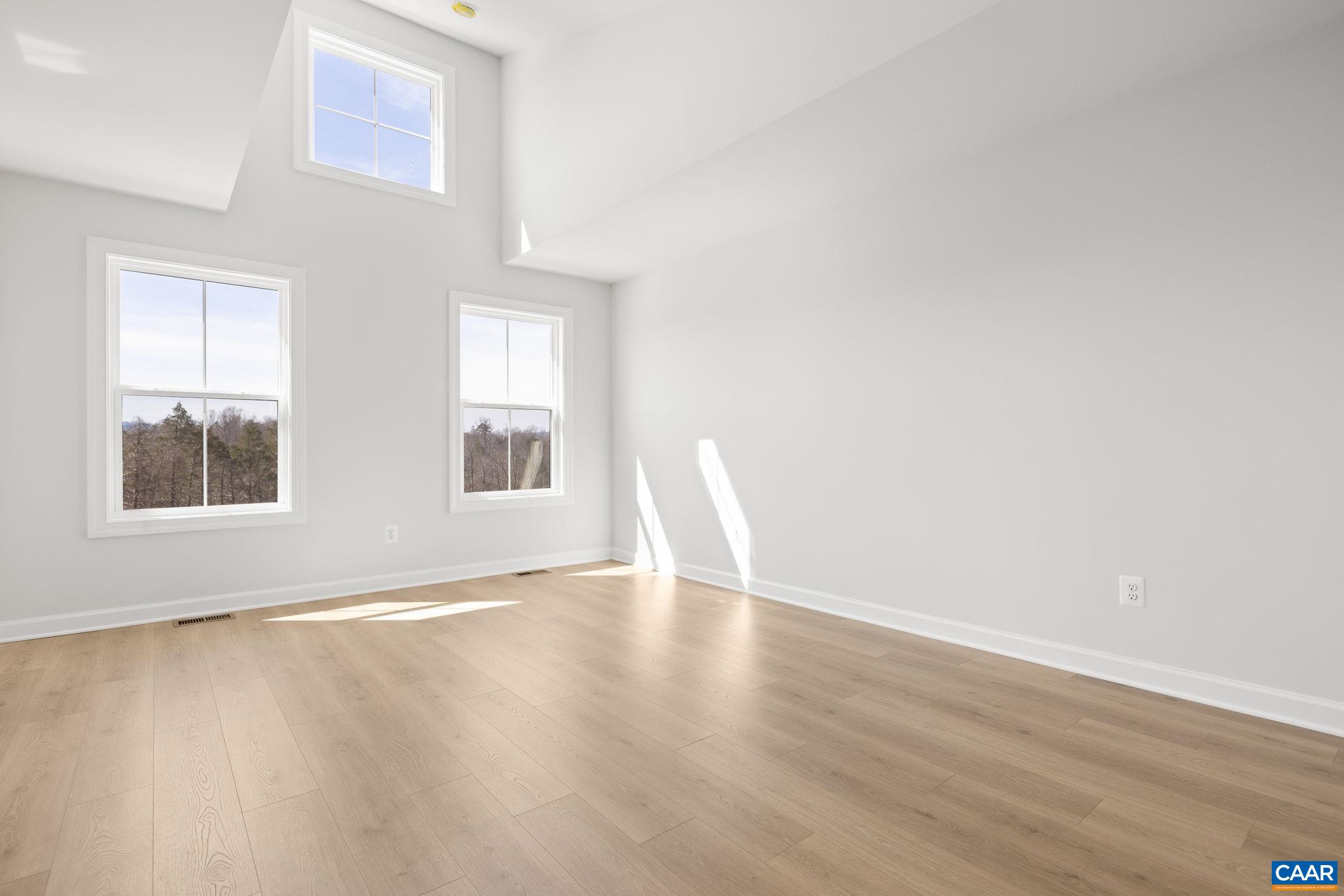 3089 Miranda Crossing Charlottesville, VA 22901 - Photo 15 of 47 a view of an empty room with wooden floor and a window