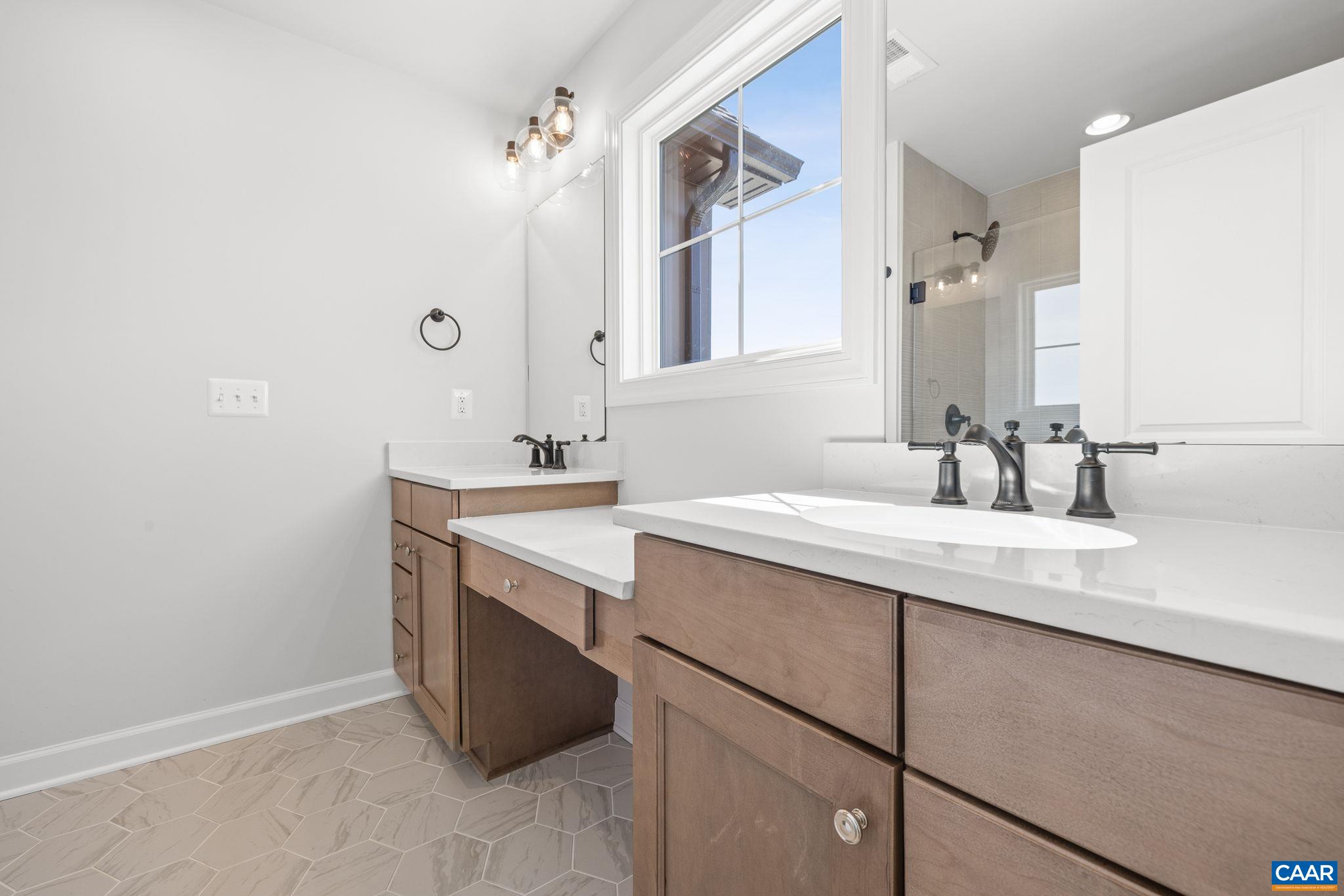 3089 Miranda Crossing Charlottesville, VA 22901 - Photo 18 of 47 a bathroom with a sink and a mirror