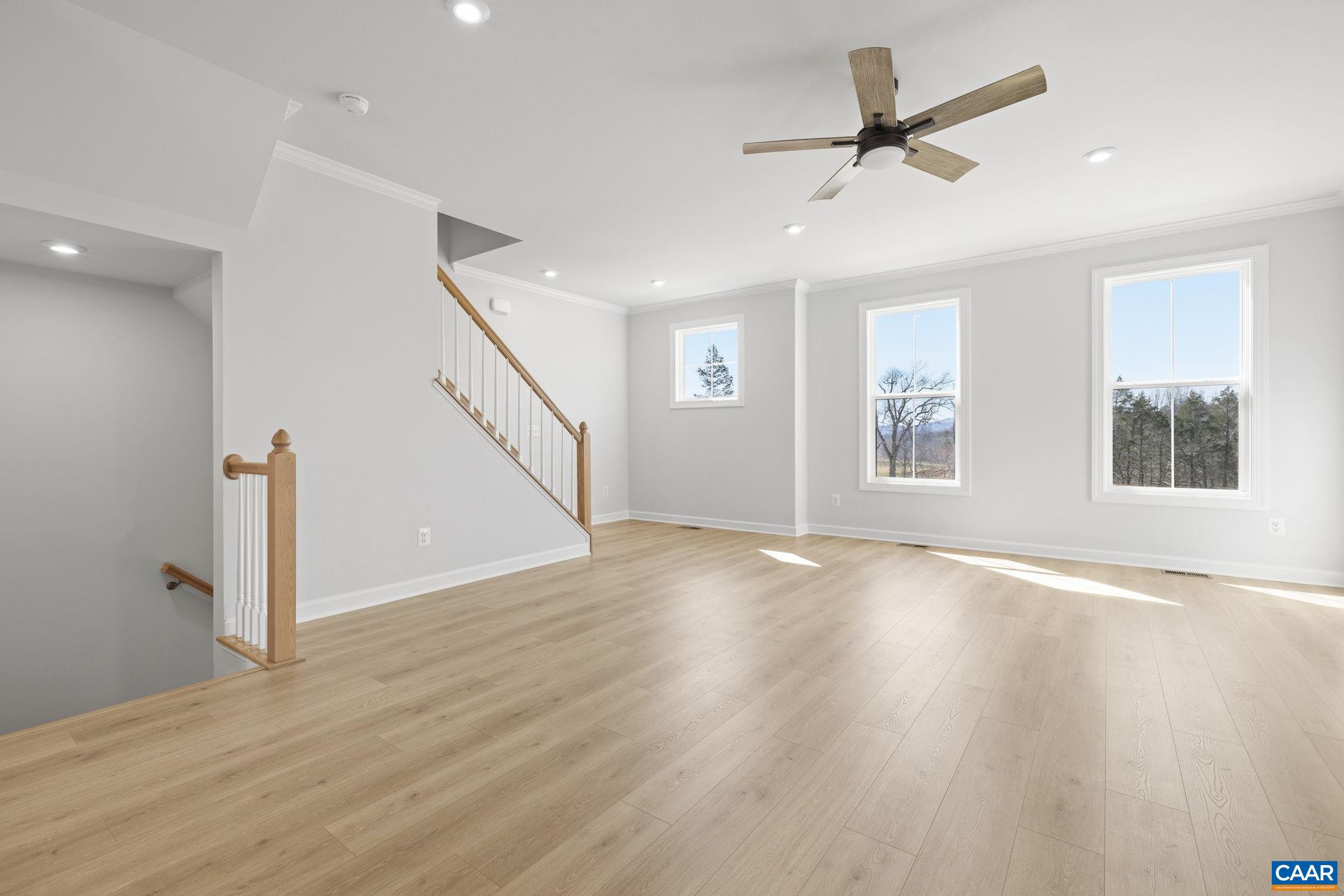 3089 Miranda Crossing Charlottesville, VA 22901 - Photo 38 of 47 a view of an empty room with wooden floor and a window