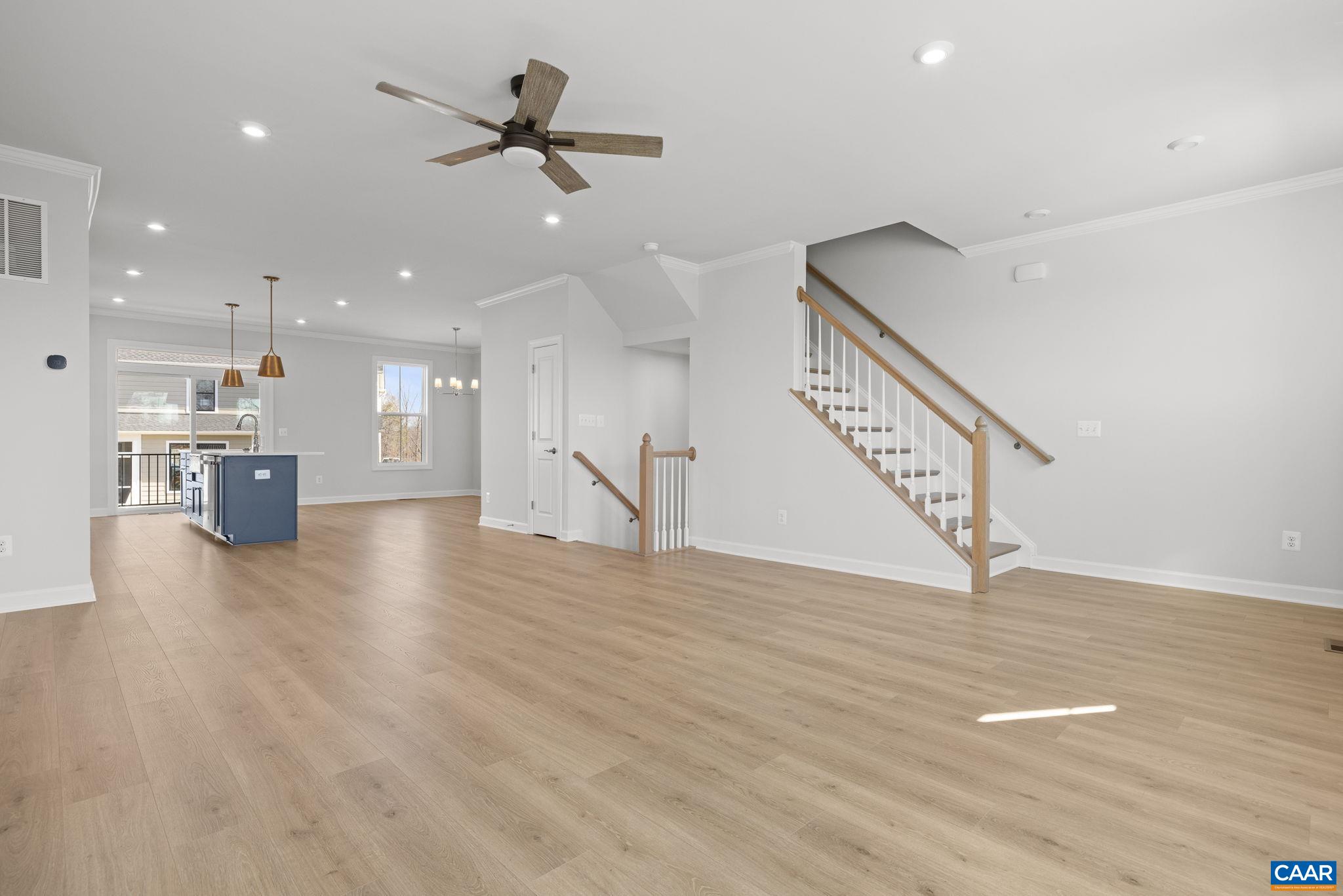 3089 Miranda Crossing Charlottesville, VA 22901 - Photo 39 of 47 a view of an empty room with wooden floor and a ceiling fan