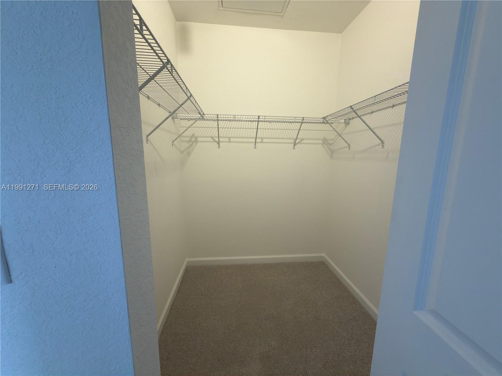 12426 Southwest 248th Street, Unit 1 Homestead, FL 33032 - Photo 13 of 13 a view of a room with racks on the wall