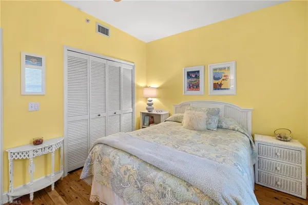a bedroom with a bed and a table in it