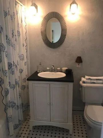 a bedroom with bed and a window