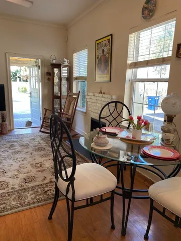 a kitchen with granite countertop a sink cabinets and window