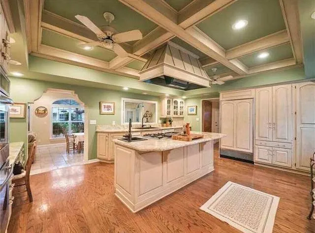 a view of a dining room with furniture and a chandelier