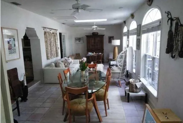a living room with lots of furniture and a chandelier