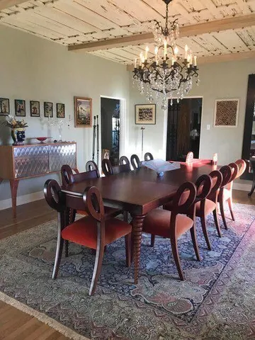a view of a dinning room with furniture window and wooden floor