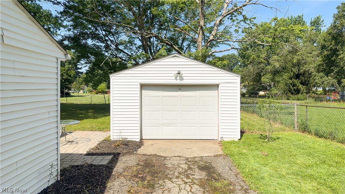3796 North Santom Road Stow, OH 44224 - Photo 23 of 30 Detached garage with white siding and a single overhead door