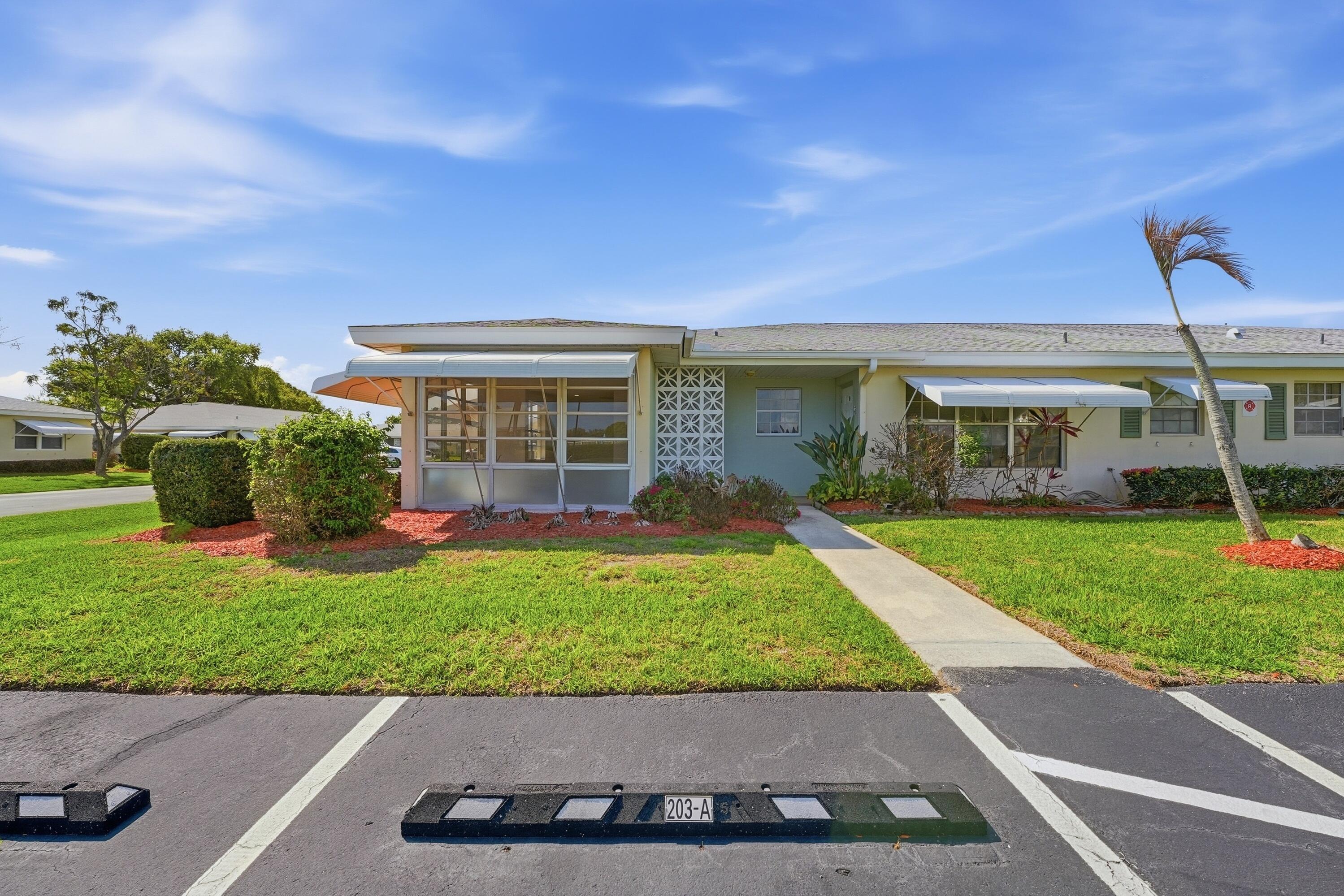 a view of a house with a garden