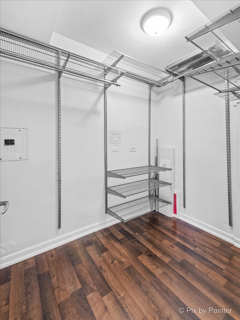 2909 North Sheridan Road, Unit 1507 Chicago, IL 60657 - Photo 13 of 27 a view of empty room with wooden floor and fan
