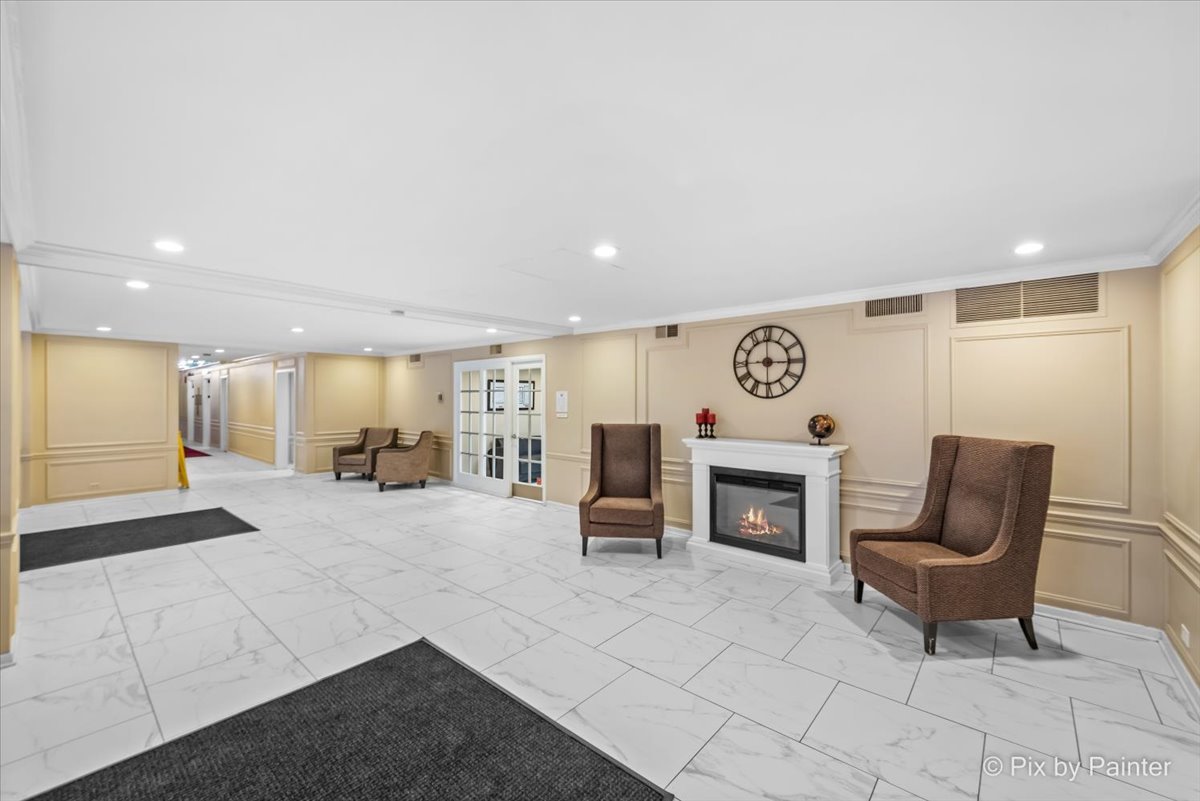 2909 North Sheridan Road, Unit 1507 Chicago, IL 60657 - Photo 17 of 27 a living room with furniture and a fireplace