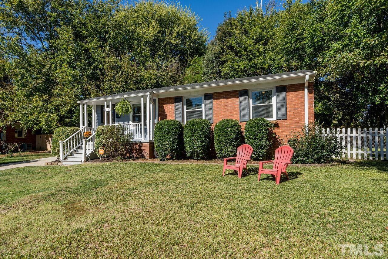 1113 North King Charles Road Raleigh, NC 27610 - Photo 2 of 24 a view of a house with backyard and garden
