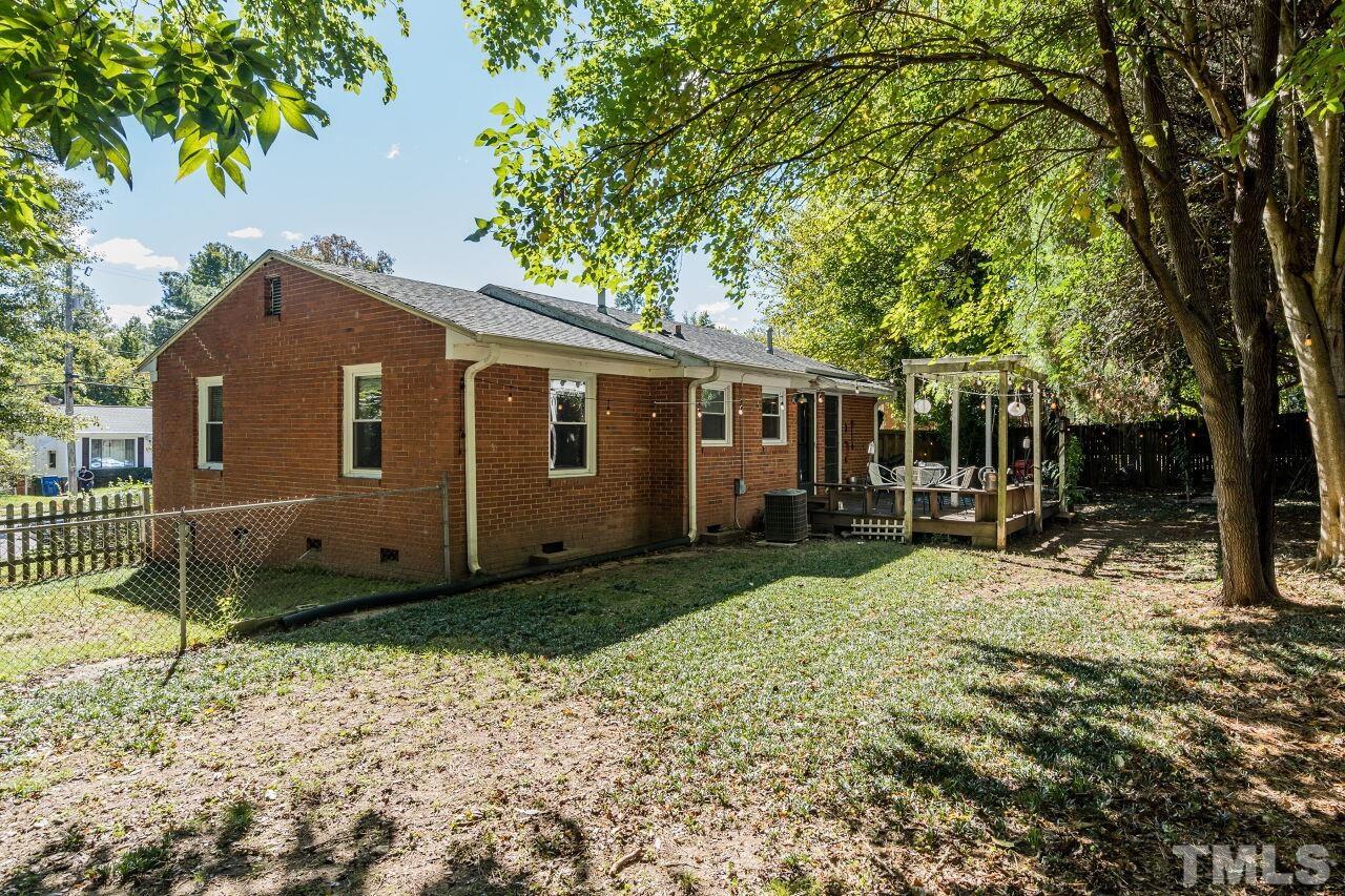 1113 North King Charles Road Raleigh, NC 27610 - Photo 23 of 24 a front view of a house with a yard
