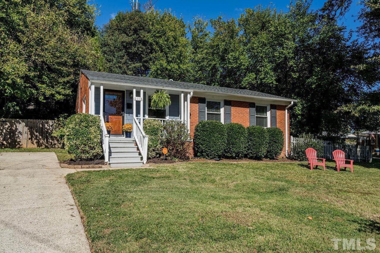1113 North King Charles Road Raleigh, NC 27610 - Photo 24 of 24 a front view of house with yard and green space