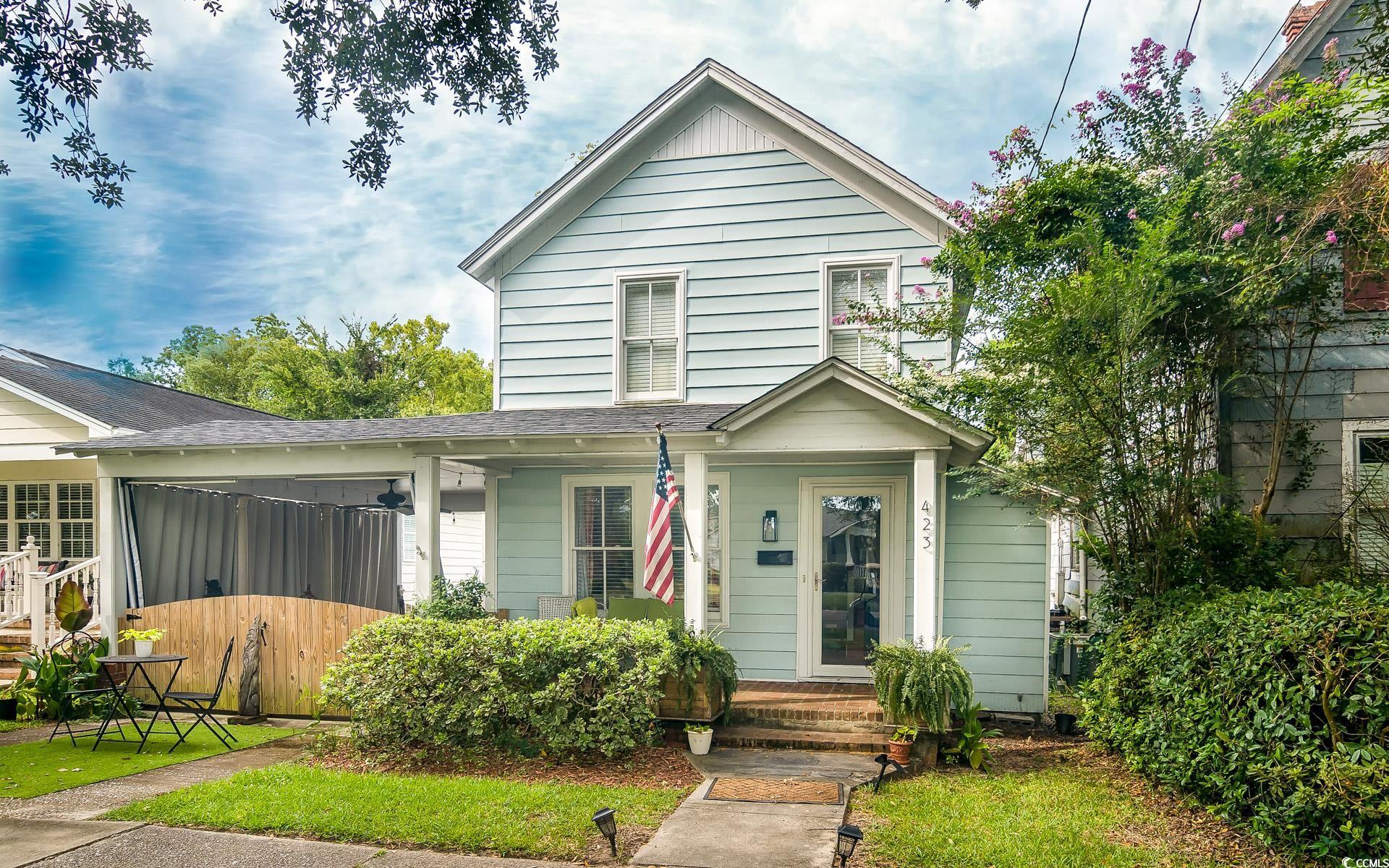 View of front of property with roof with shingles