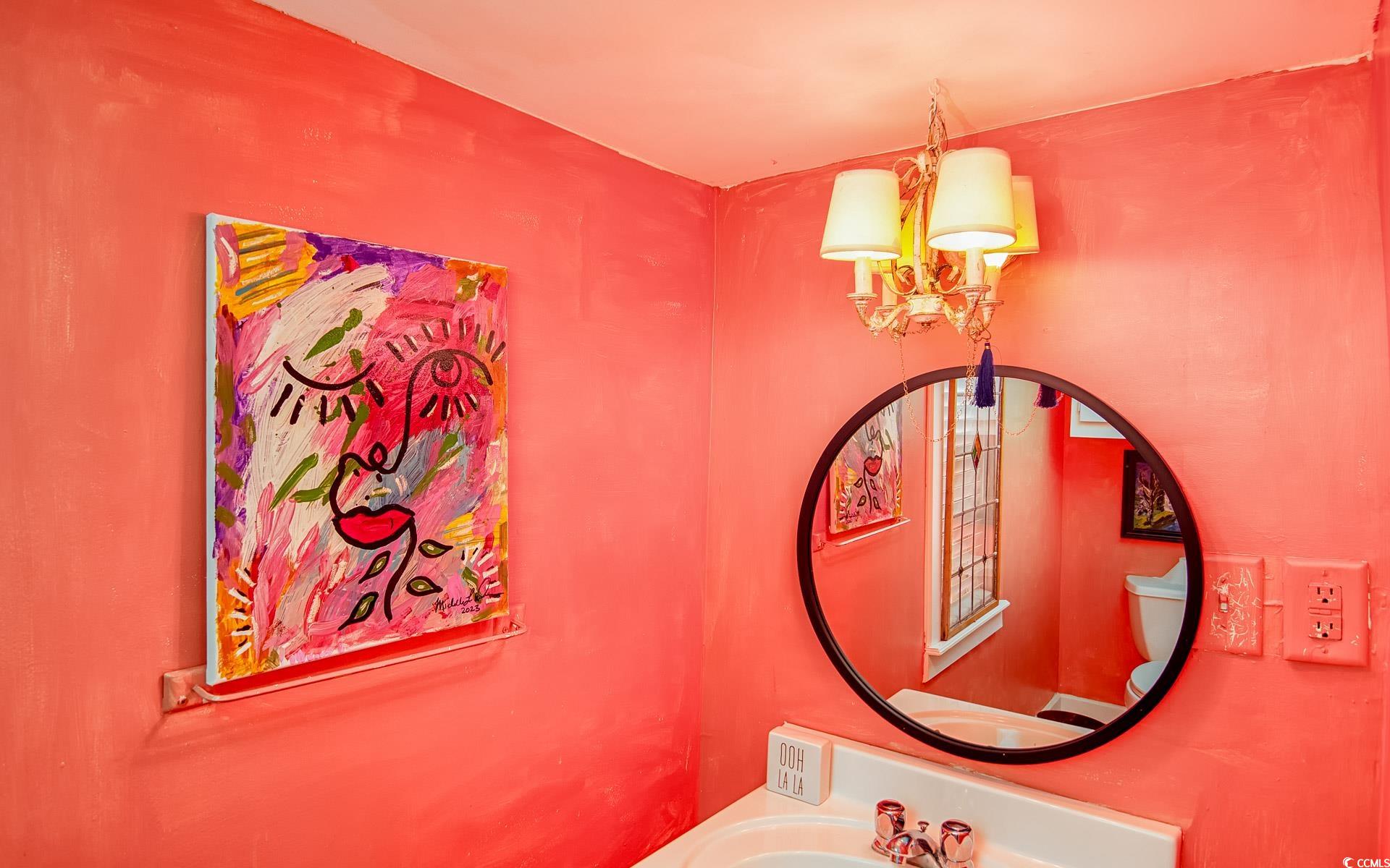 423 Highmarket Street Georgetown, SC 29440 - Photo 8 of 25 Bathroom with a chandelier and a sink