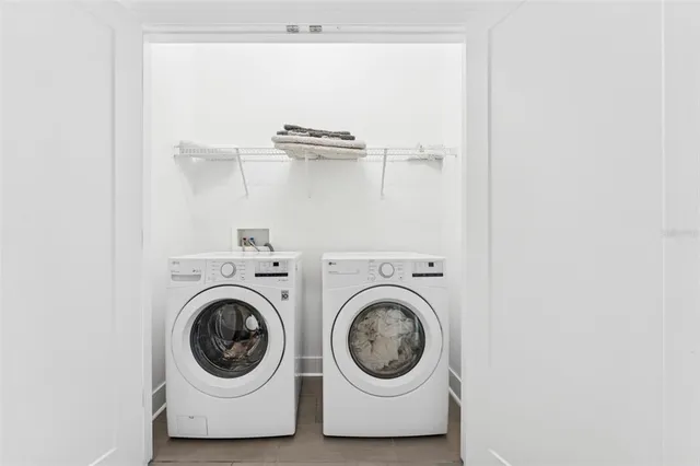 a view of a street with houses on the side
