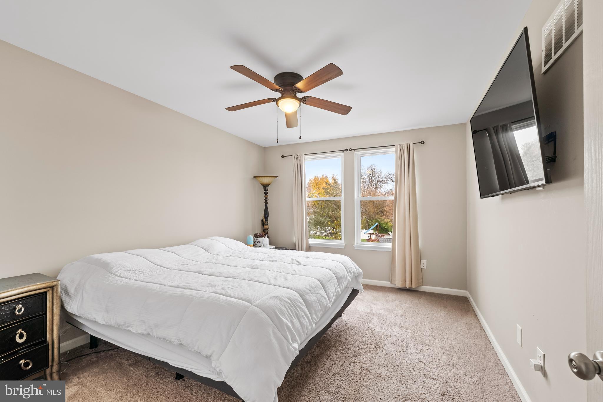 208 Pelham Road South Voorhees, NJ 08043 - Photo 15 of 33 a bedroom with a bed and a television