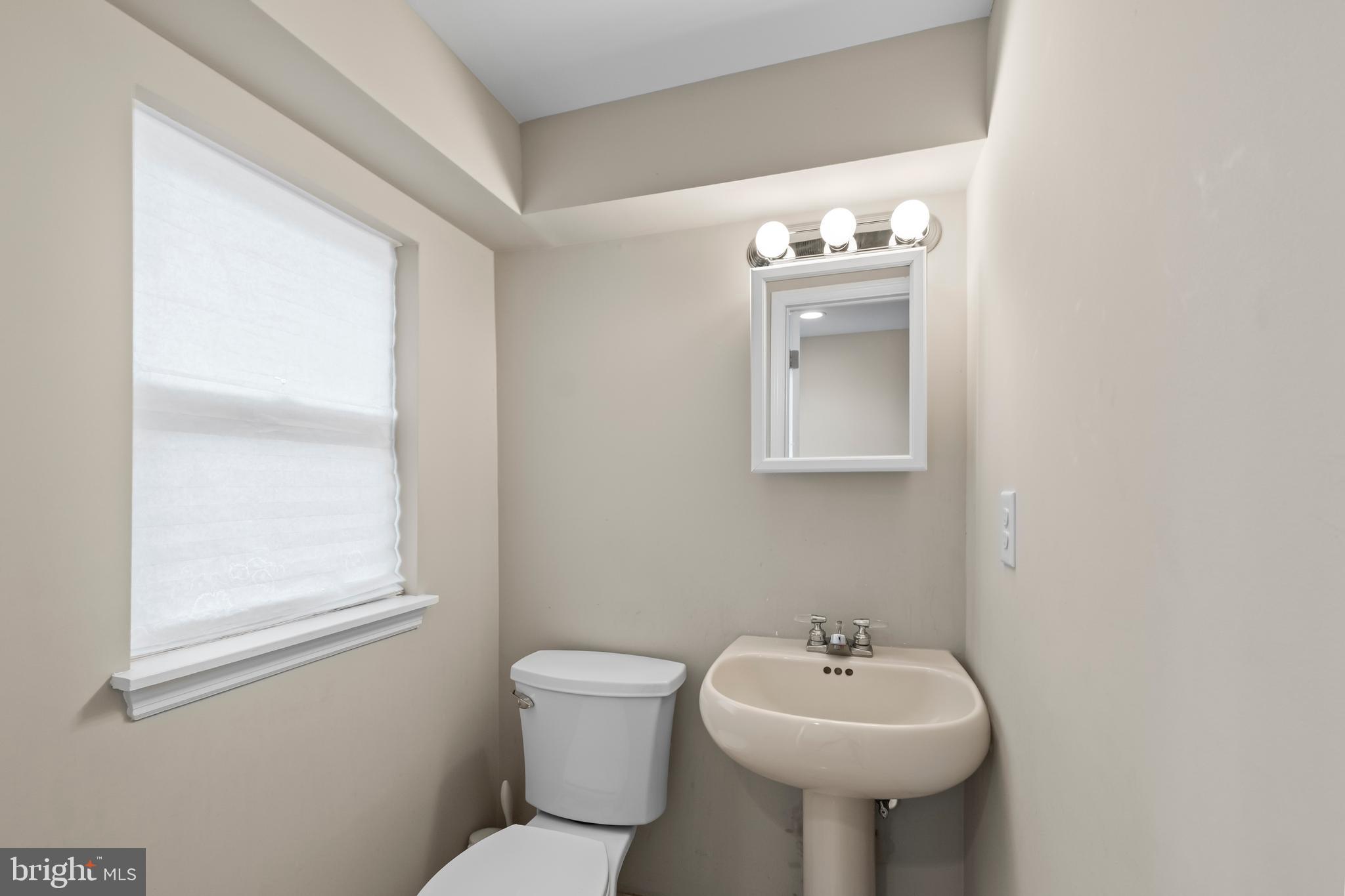 208 Pelham Road South Voorhees, NJ 08043 - Photo 20 of 33 a bathroom with a sink mirror and toilet