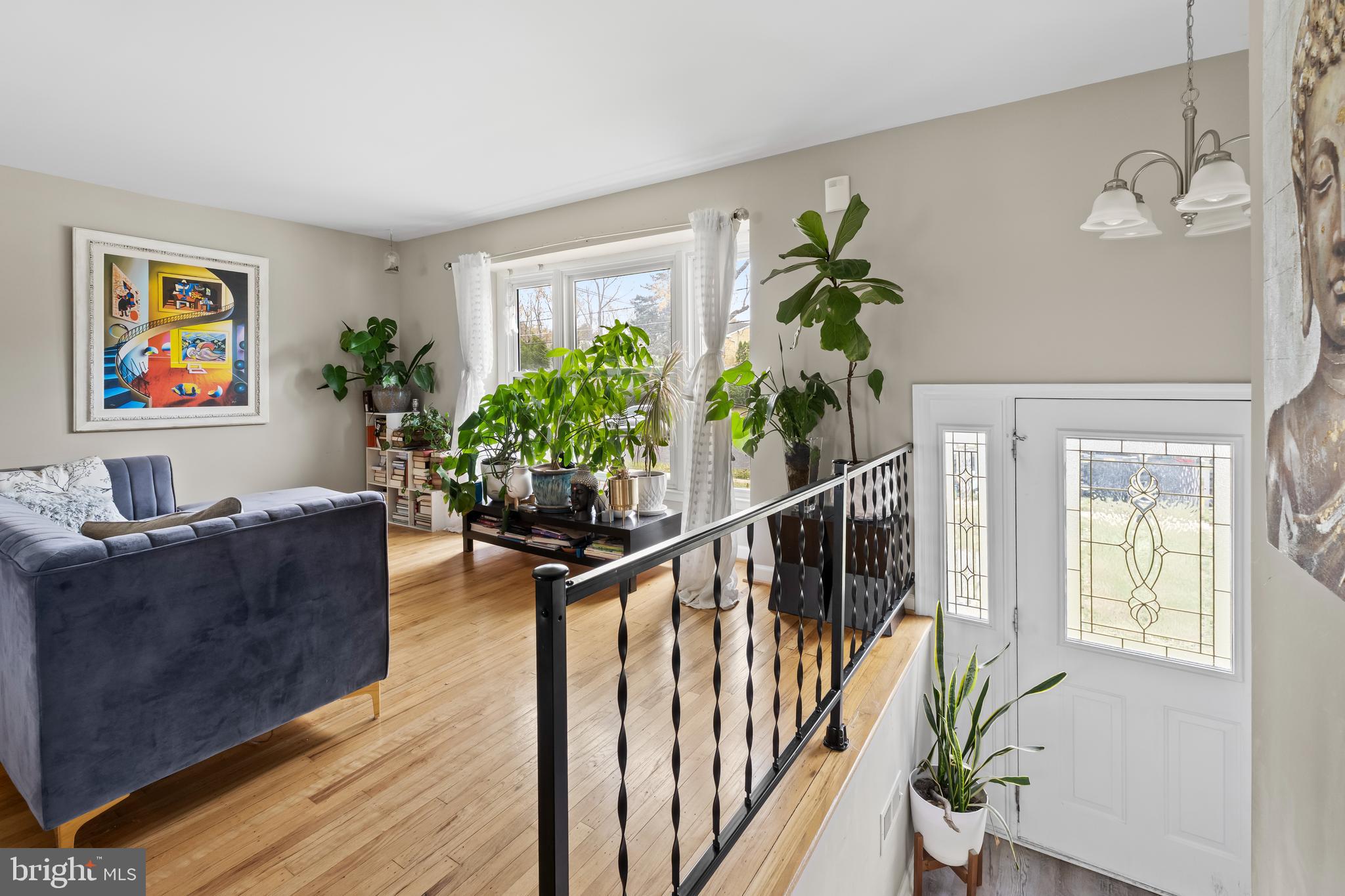 208 Pelham Road South Voorhees, NJ 08043 - Photo 5 of 33 a living room with furniture potted plant and a window
