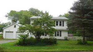 477 Pinney Road Somers, CT 06071 - Photo 1 of 1 a front view of a house with a yard and trees
