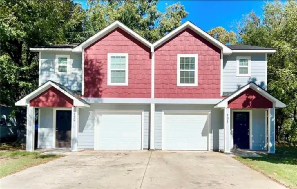 a front view of a house with yard