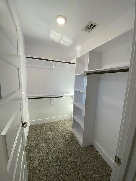 131 East Bond Street Denison, TX 75021 - Photo 9 of 10 a view of walk in closet with empty racks