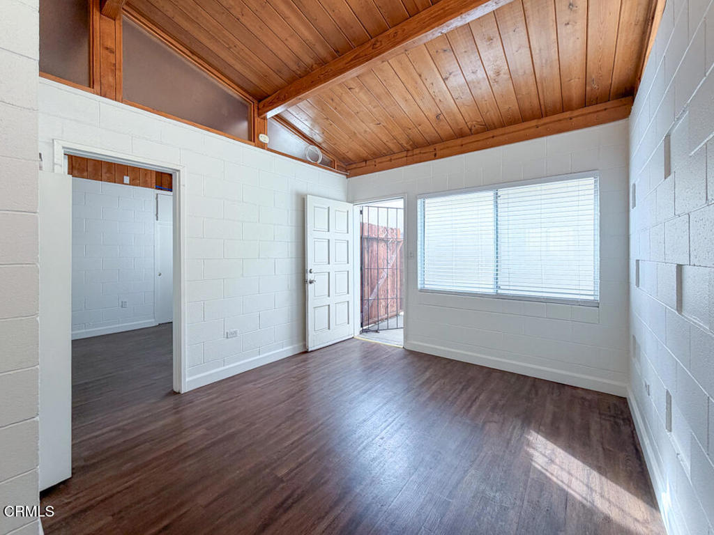 313 Highland Drive Oxnard, CA 93035 - Photo 2 of 16 a view of an empty room with wooden floor and a window