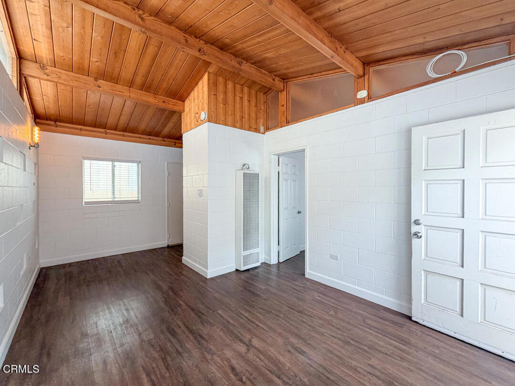 313 Highland Drive Oxnard, CA 93035 - Photo 3 of 16 a view of a room with wooden floor and cabinet