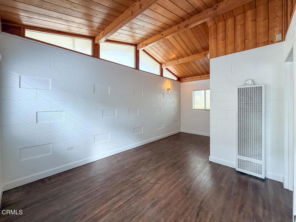313 Highland Drive Oxnard, CA 93035 - Photo 4 of 16 a view of an empty room with wooden floor and windows