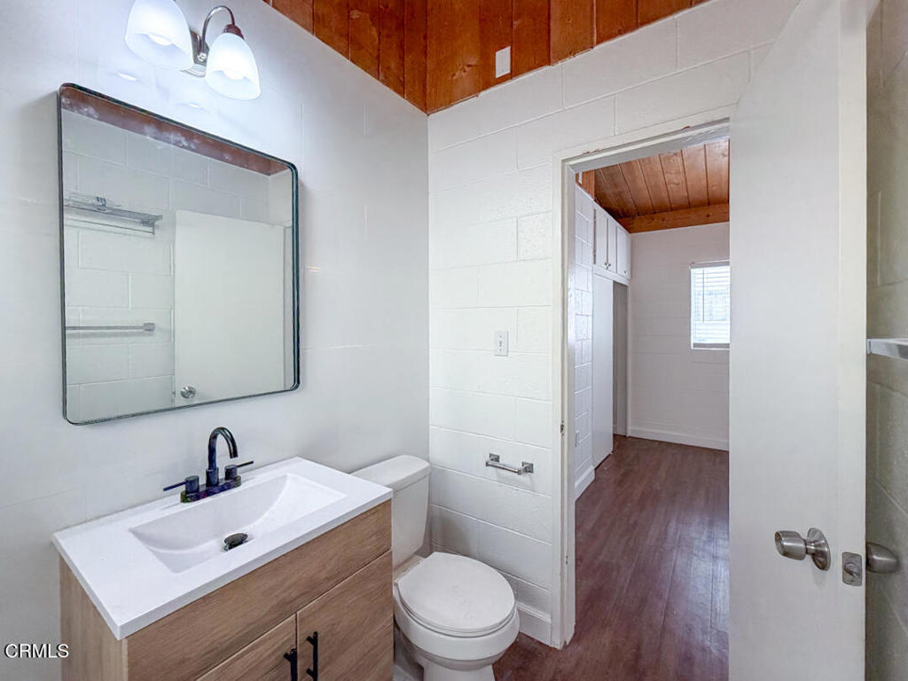 313 Highland Drive Oxnard, CA 93035 - Photo 7 of 16 a bathroom with a toilet sink and mirror
