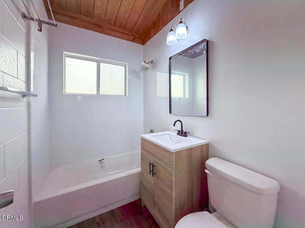 313 Highland Drive Oxnard, CA 93035 - Photo 8 of 16 a bathroom with a toilet sink and mirror