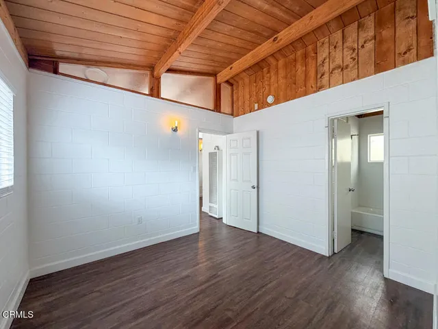 a view of hallway with wooden floor