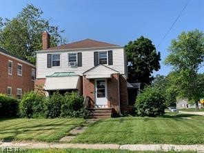 680 Babbitt Road Euclid, OH 44123 - Photo 1 of 1 View of front property featuring a front lawn