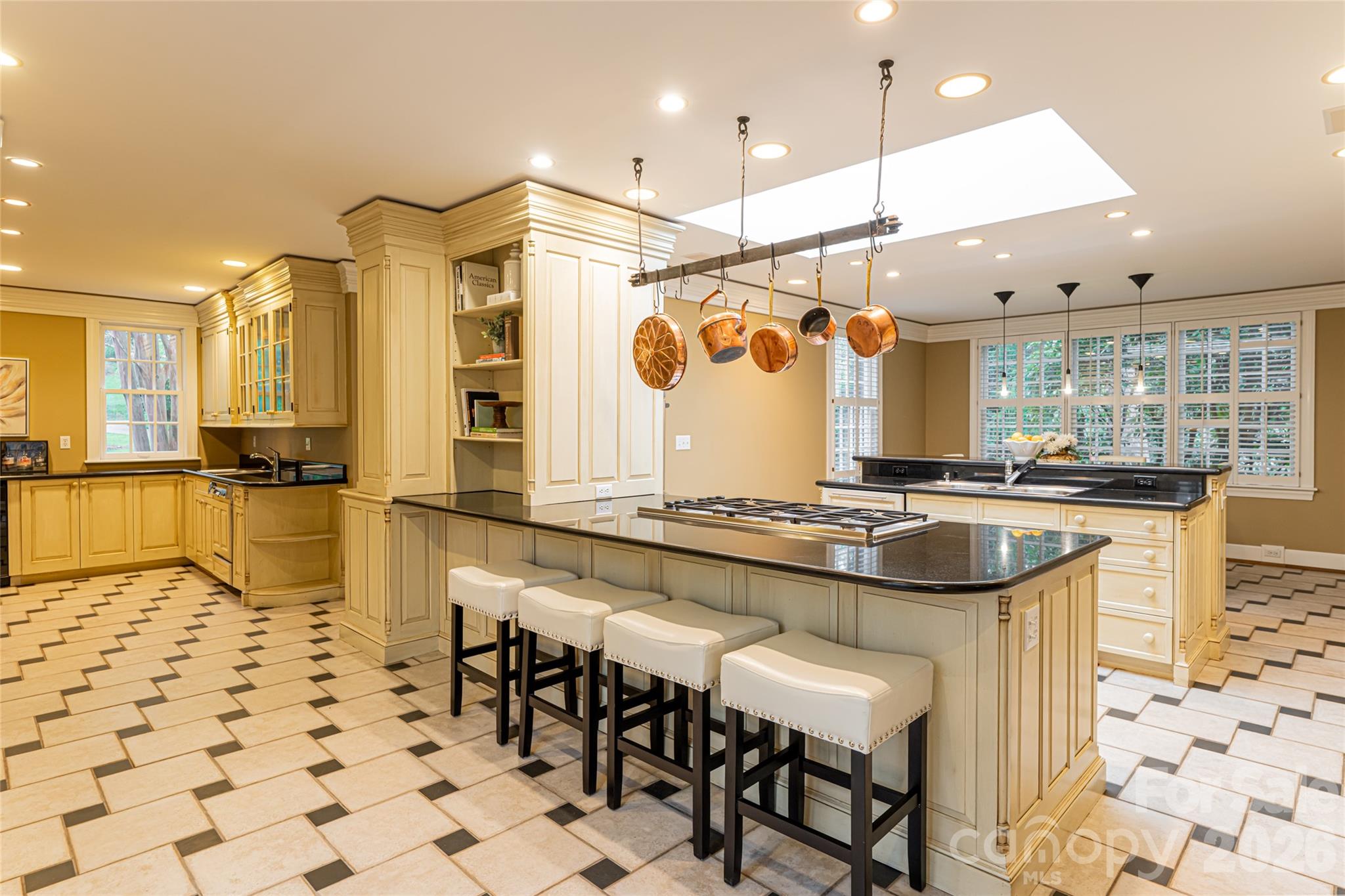 31 Busbee Road Asheville, NC 28803 - Photo 21 of 48 a kitchen with a sink and chairs