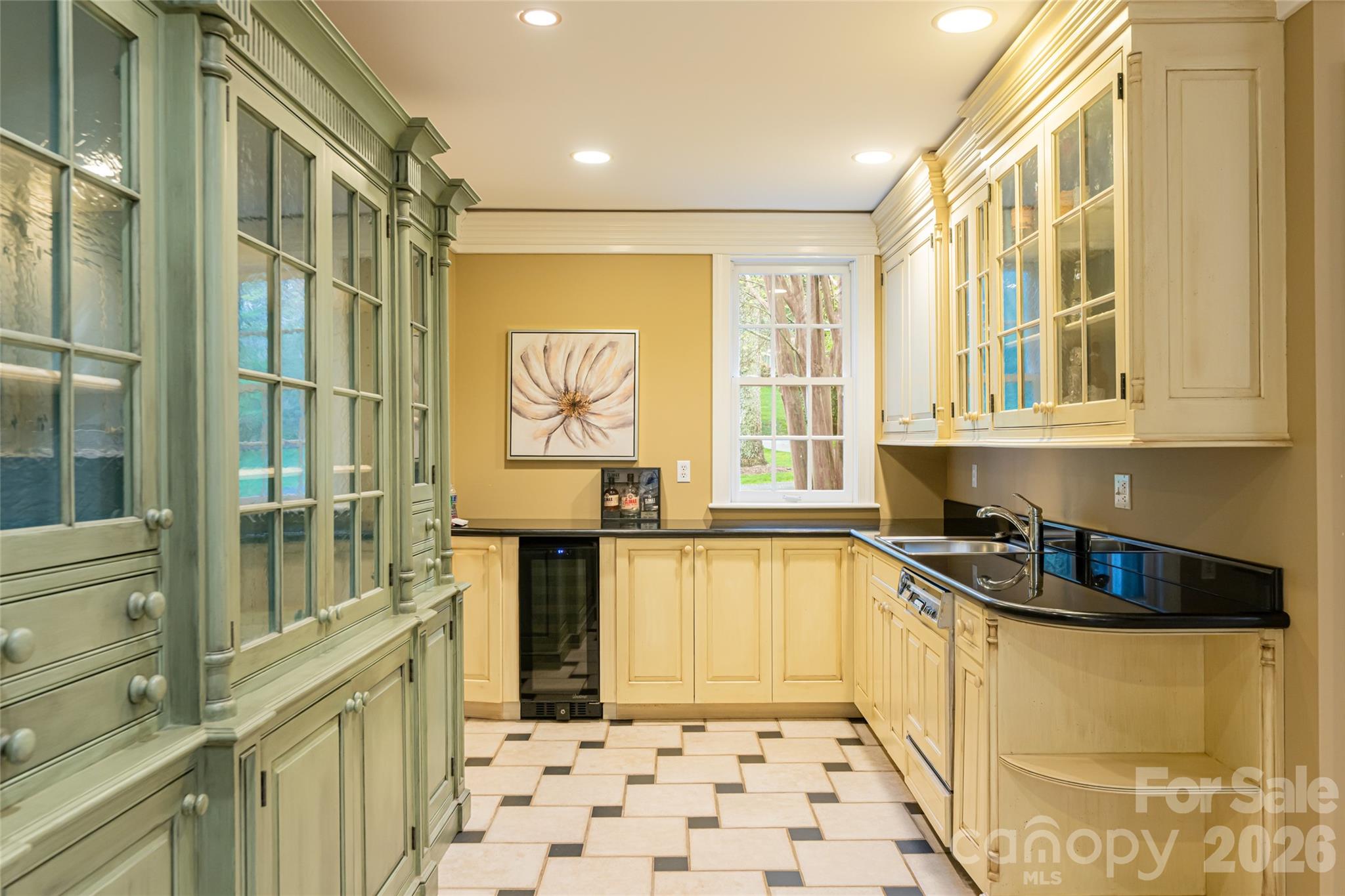 31 Busbee Road Asheville, NC 28803 - Photo 22 of 48 a kitchen with a sink a stove a refrigerator and cabinets