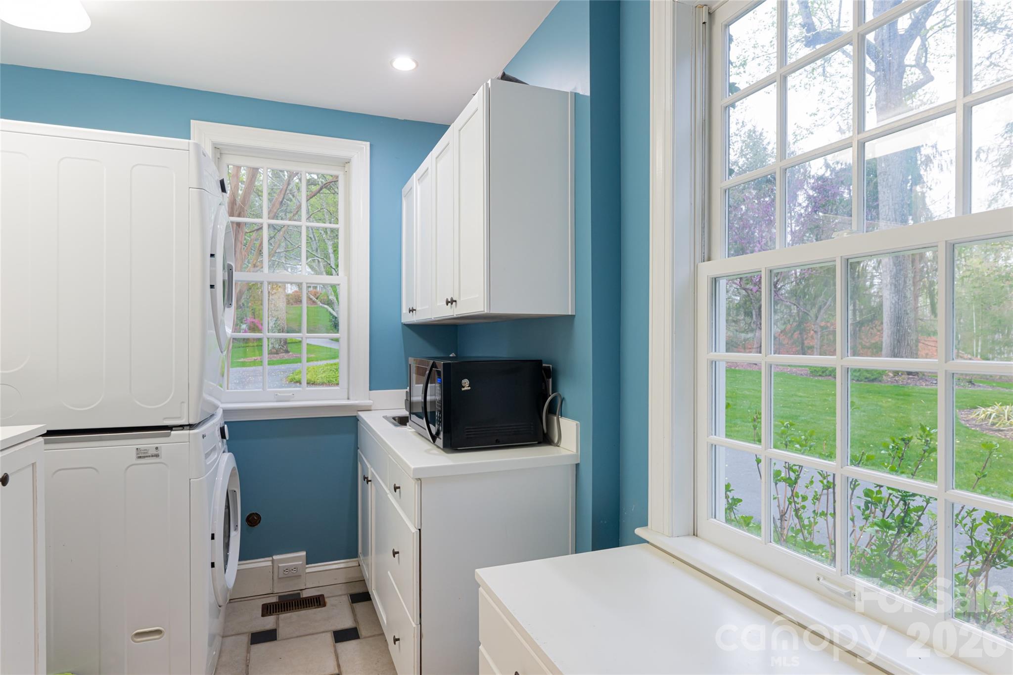 31 Busbee Road Asheville, NC 28803 - Photo 29 of 48 a kitchen with a refrigerator a sink and a window