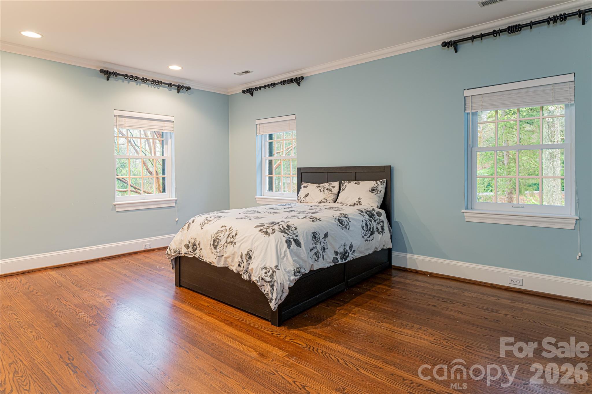31 Busbee Road Asheville, NC 28803 - Photo 38 of 48 a bed sitting in a spacious bedroom next to a window