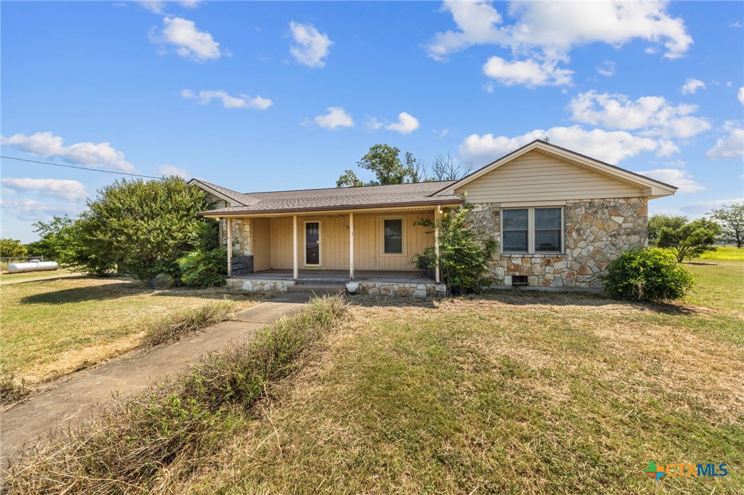 12558 Guyton Road Troy, TX 76579 - Photo 4 of 32 a front view of a house with a garden