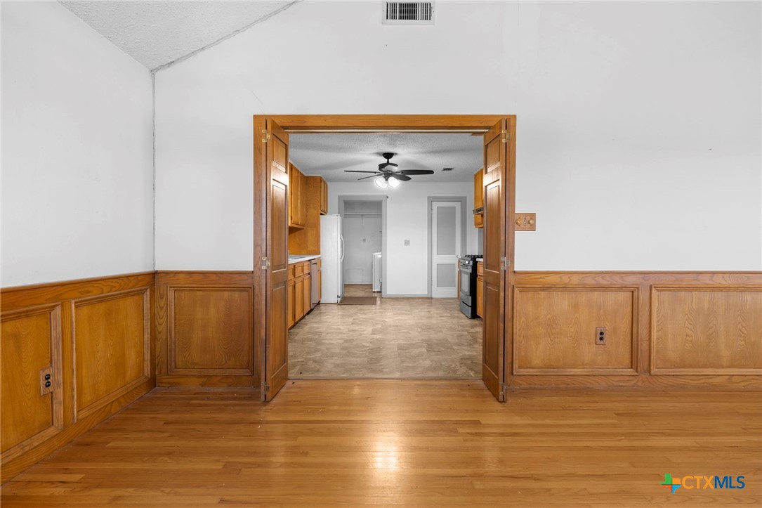 12558 Guyton Road Troy, TX 76579 - Photo 8 of 32 a view of a hallway with wooden floor