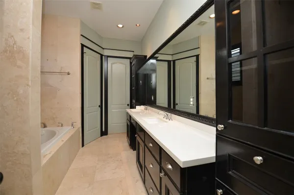 a bathroom with a bathtub and shower