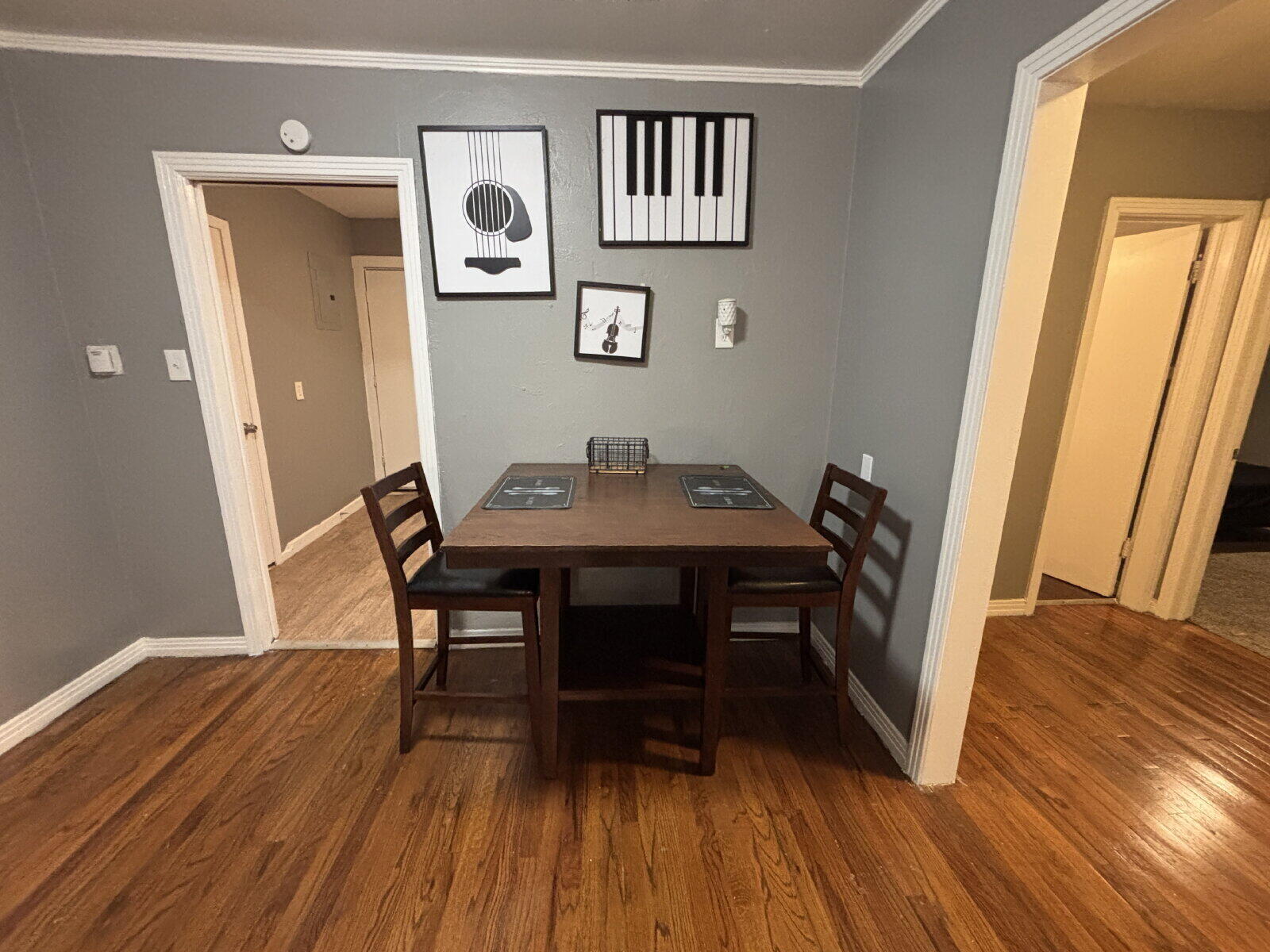 1808 14th Street, Unit 2 Lubbock, TX 79401 - Photo 3 of 8 a view of a dining room with furniture and wooden floor