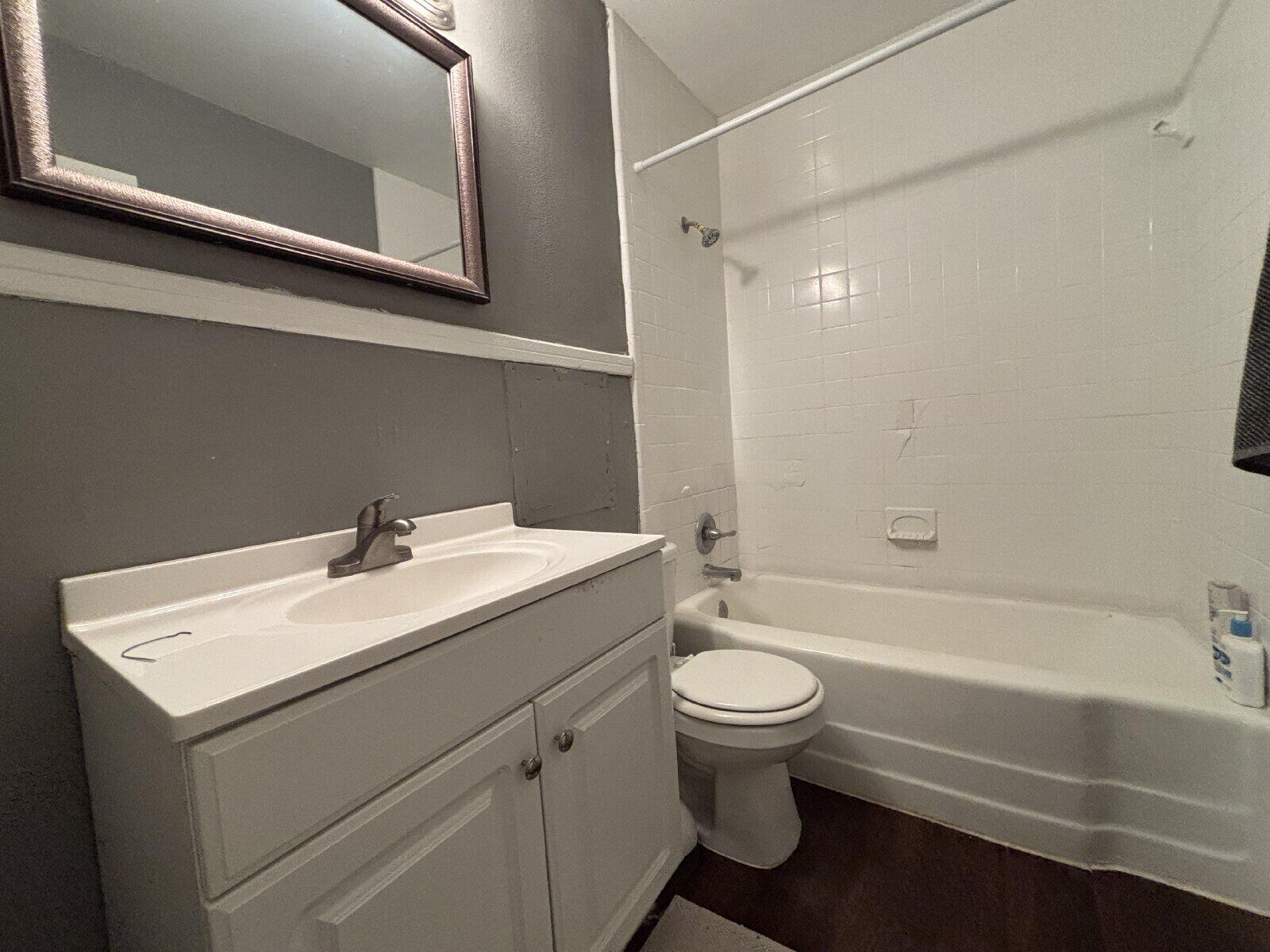 1808 14th Street, Unit 2 Lubbock, TX 79401 - Photo 6 of 8 a bathroom with a sink toilet vanity and shower