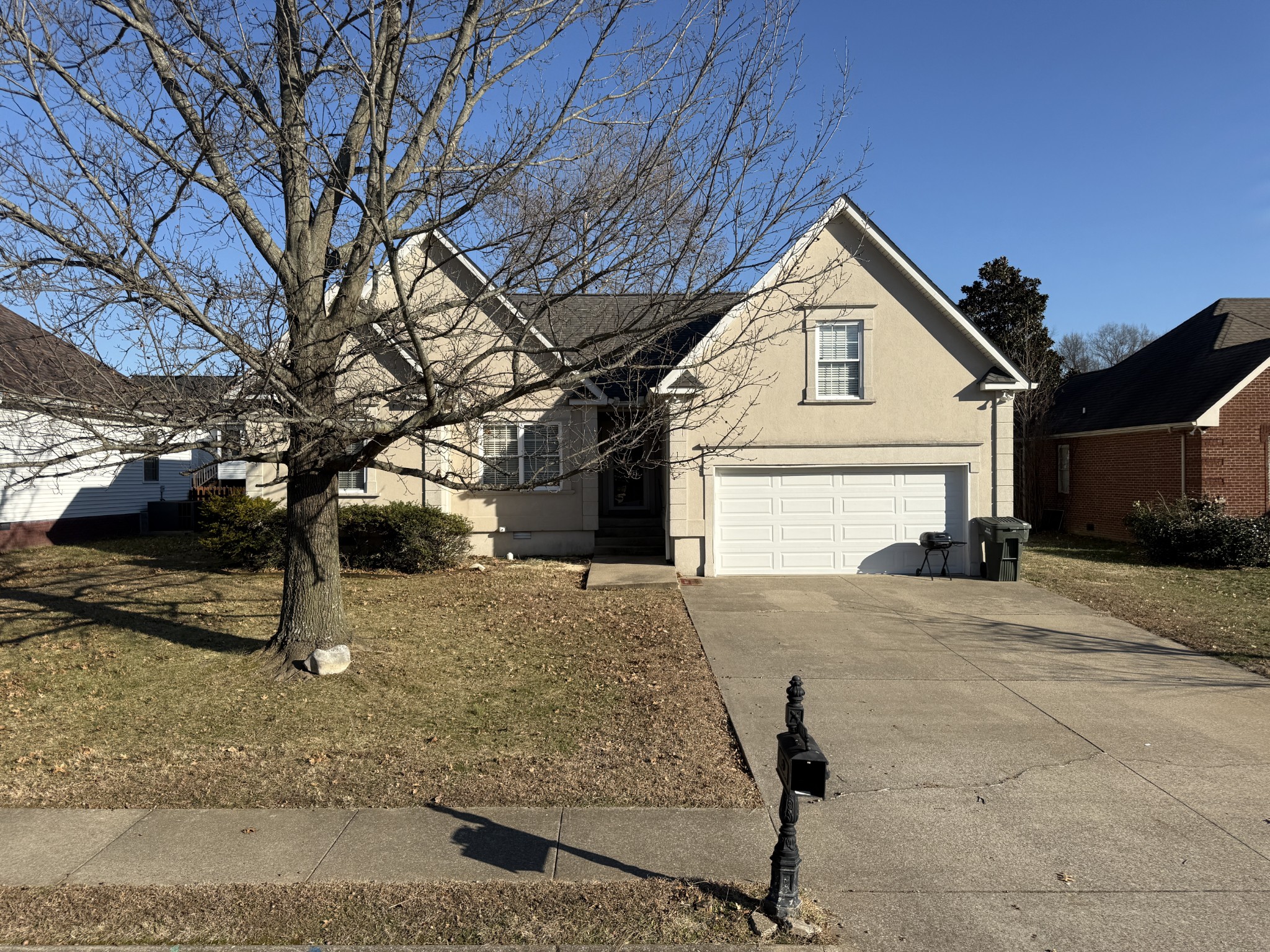 128 Fieldstone Lane Springfield, TN 37172 - Photo 2 of 8 a view of garage yard and tree
