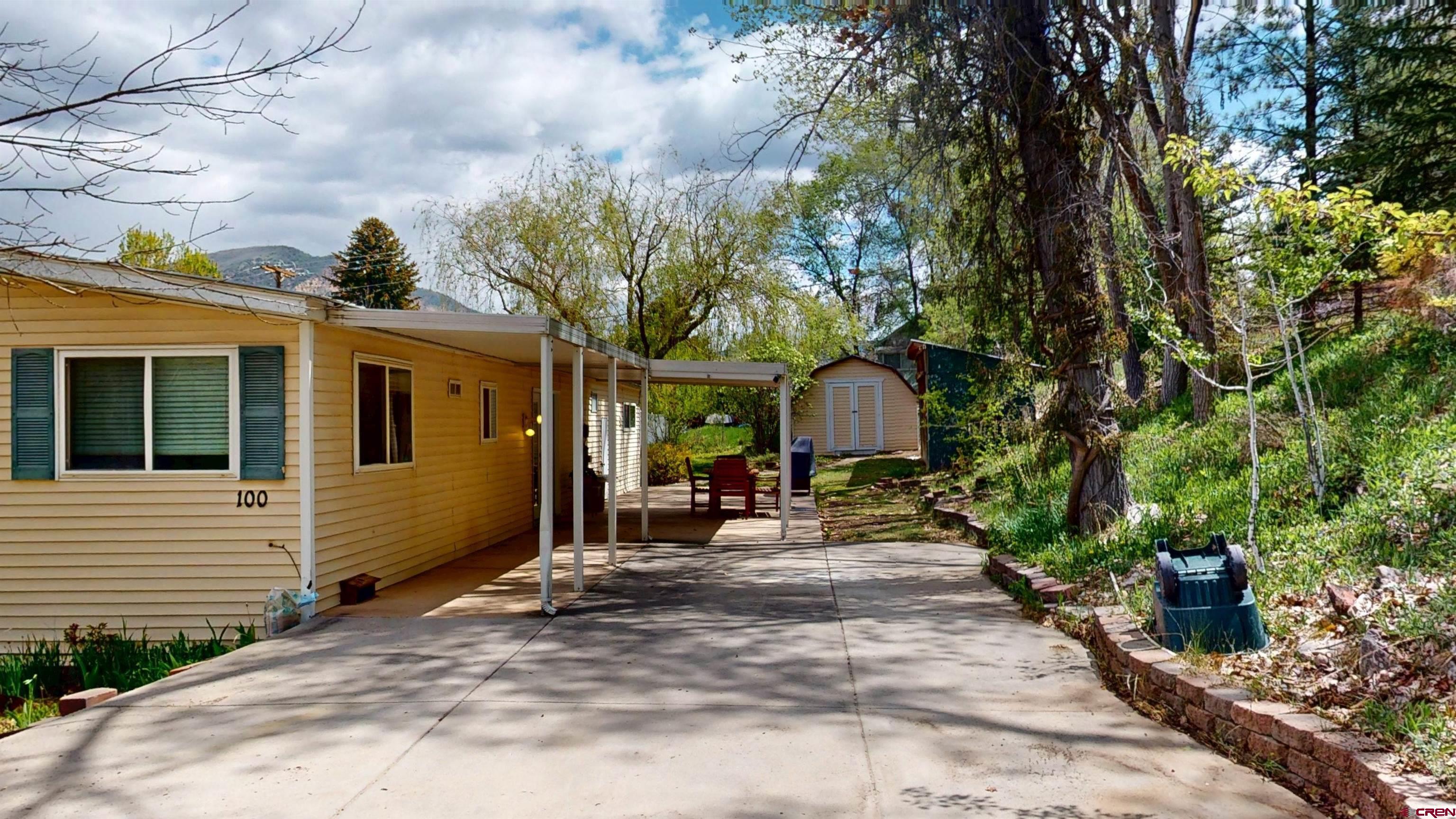 100 Rio Grande Avenue Paonia, CO 81428 - Photo 2 of 45 a view of a house with sitting area and garden